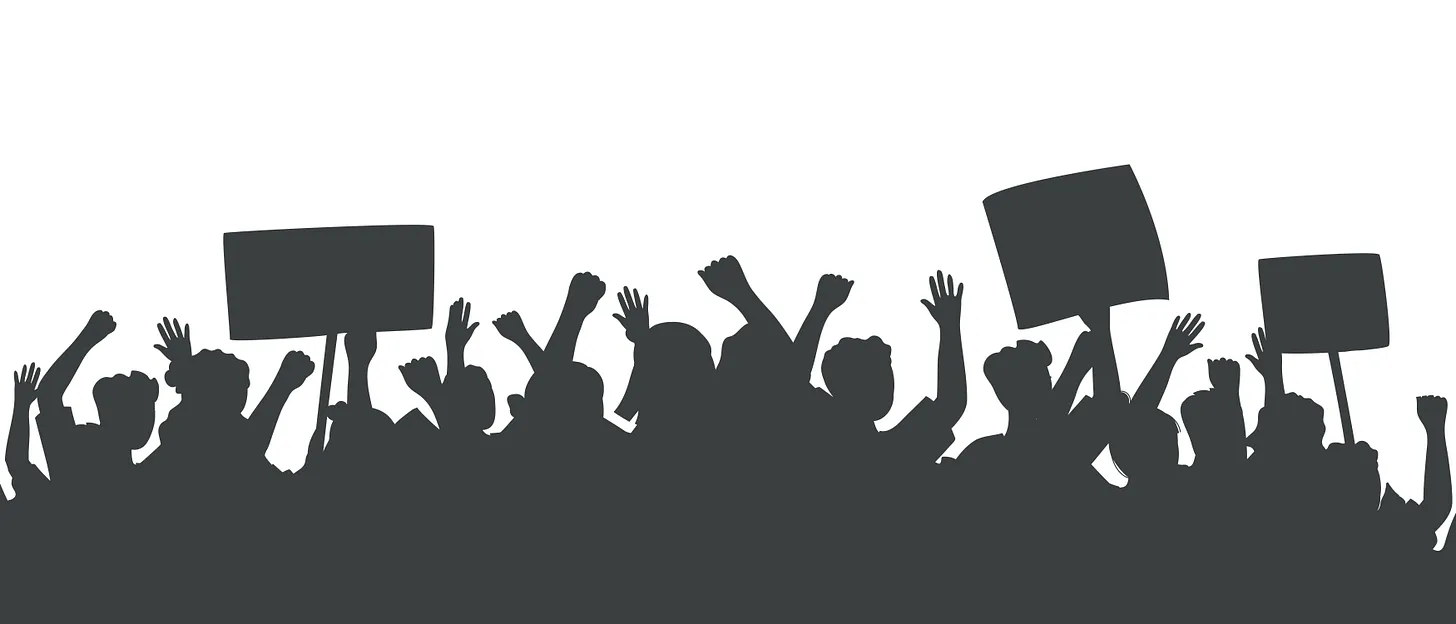 A high-contrast, black-and-white silhouette of a crowd of people holding up signs and posters at a strike or rally.