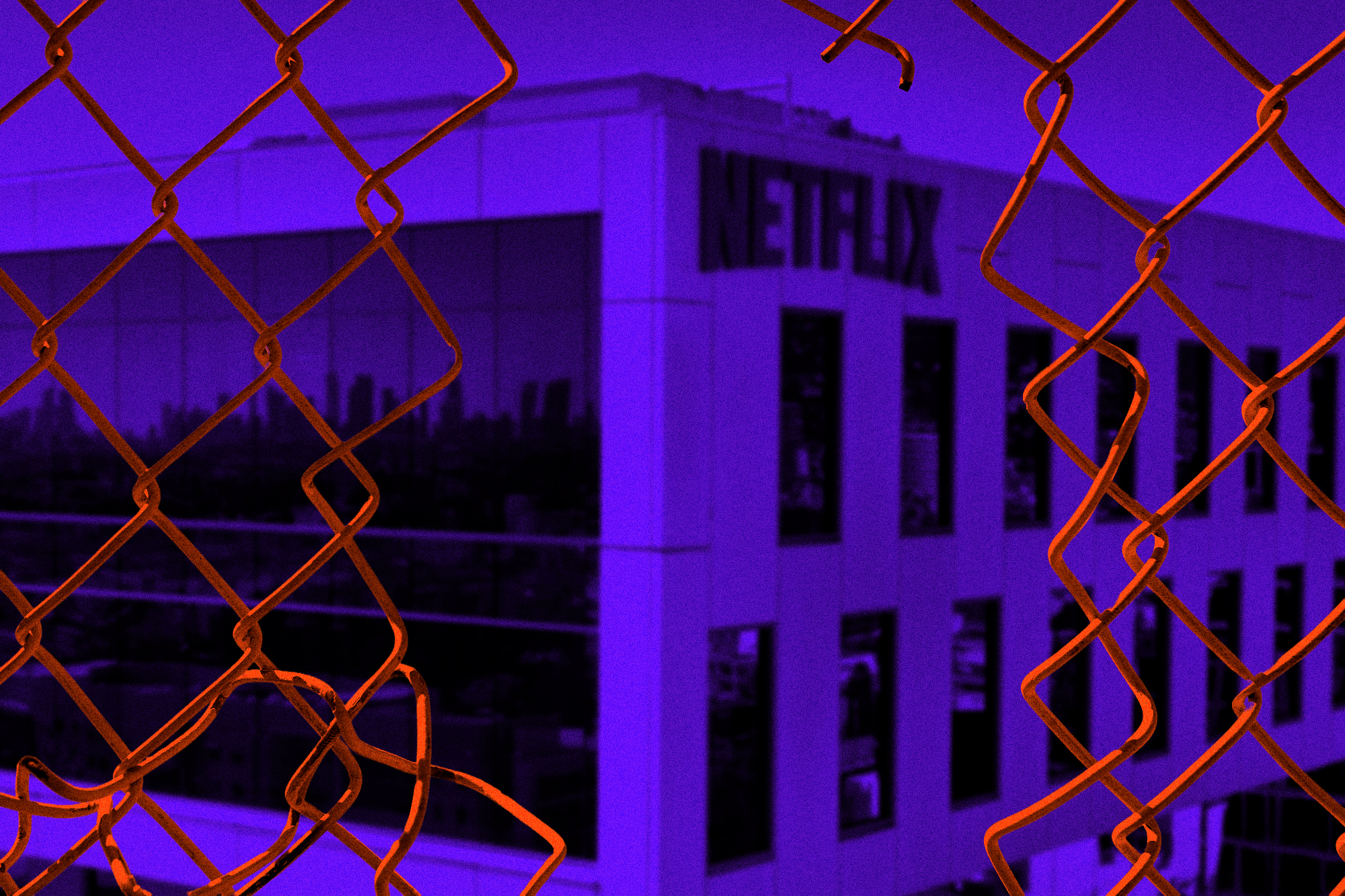 broken chain-link fence in front of the Netflix office building